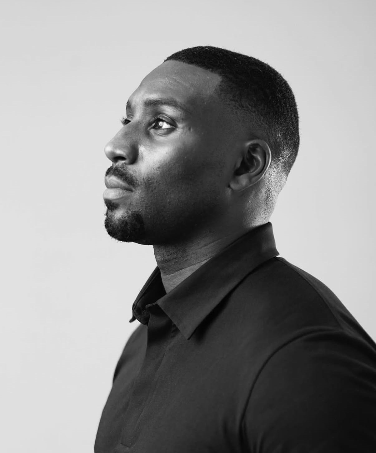 Julian Owusu, founder and CEO of BUILD Group — black-and-white portrait